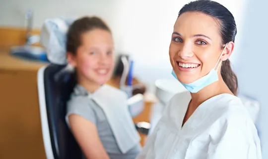 orthodontist assistant smiling at patient